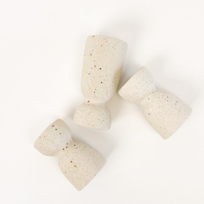 Grouping of pumice Minimalist Candle Holders. Sleek and sculptural. The perfect accent for the modern home. Holds a standard taper candle. Each sold separately.