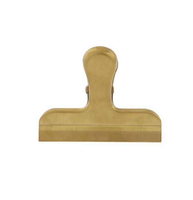 Brass clip. Perfect for sealing up bags in the pantry or for use in the office. Made of stainless steel with a brass finish. 