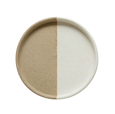 Eclipse Stoneware Tray is crafted from natural speckled stoneware. One half of this beautiful tray is coated in a creamy smooth glaze. The perfect compliment for displaying jewelry or other treasures. Measures 9.75" diameter, 1.25" depth.