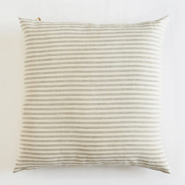 Palma Stripe Pillow in 100% linen with 1/2" stripes in oatmeal and ivory. Finished with a brass zipper with leather cord and wood bead pull. 27" square. Down insert included.