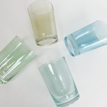 Bubble glass drinking glasses in 4 shades of coastal inspired colors. Seagrass, turquoise, verde and amber. Each sold separately.