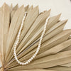 White Keishi pearl necklace. 16" length with a 3" extender and lobster claw clasp. Made by Momento Mori Designs NYC.
