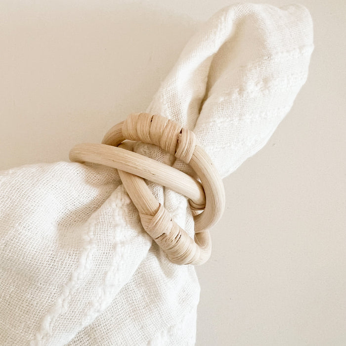 Rattan link napkin rings styled with a white Serena gauze napkin. Each sold separately.