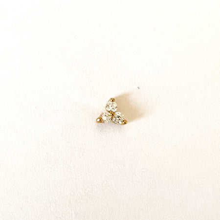 Sabrina crystal stud earring by Ellie Vail. Three clear CZ stones clustered on a single stud with a flat screw back. Sold individually. Sweat, water and tarnish resistant. Made of marine grade stainless steel with gold plating and CZ stones.