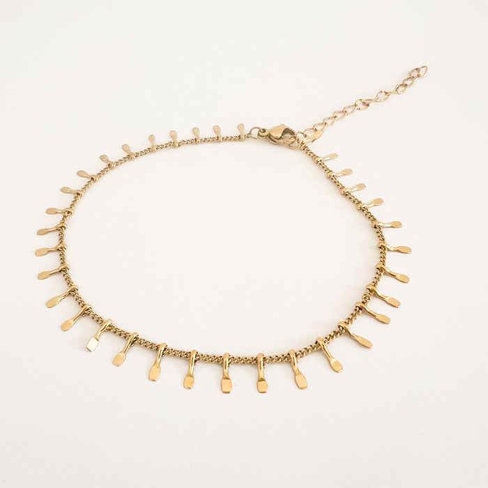 Adilene chain anklet by Ellie Vail. Sweat, water and tarnish resistant. Delicate gold chain anklet with tiny gold charms. Measures 8" with 2" extender. Made of hypoallergenic stainless steel, gold plated.