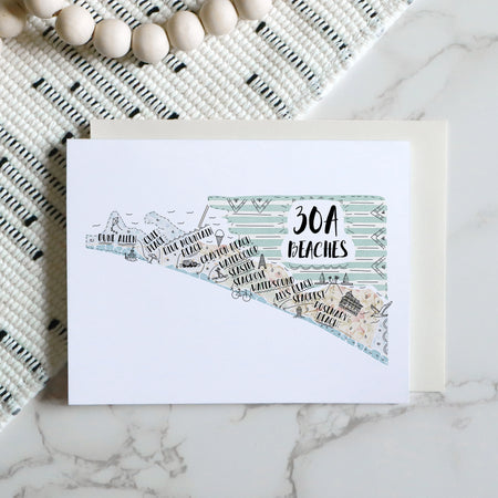 Greeting card with '30A Beaches' design on a marble surface