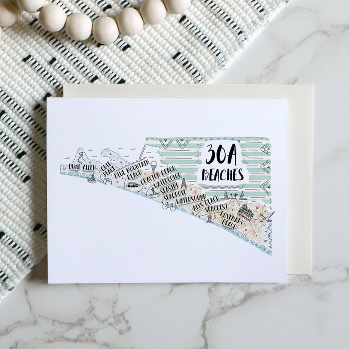 Greeting card with '30A Beaches' design on a marble surface