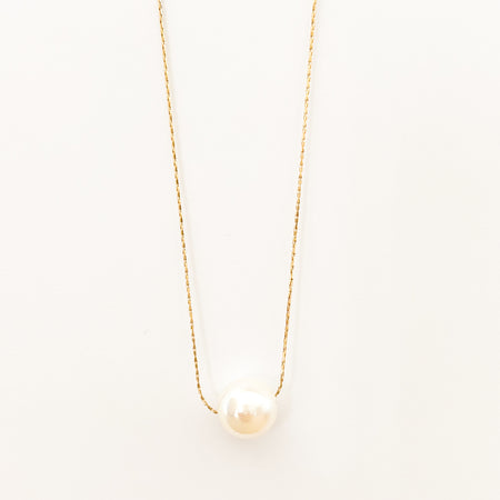 Coco Pearl necklace by Ellie Vail. Delicate 16" gold chain with a solitary pearl. Sweat, water and tarnish resistant. Made of marine grade stainless steel with gold plating.