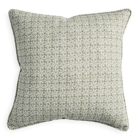 Girona Celadon pillow by Walter G. 100% linen pillow hand block printed in an over lapping motif of rings and fronds in a palette of celadon and moss green on a natural linen base. 20" square with piped edges. Down insert included. Zip closure.