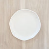 White melamine "Cloud" salad plate. Part of the Nube collection by Beatrix Ball. Organic irregular shape with a matte white finish. Measures 9" diameter.