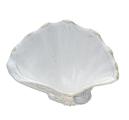 White ceramic scallop shell dish. Measures 7.75" x 6" x 2.25".