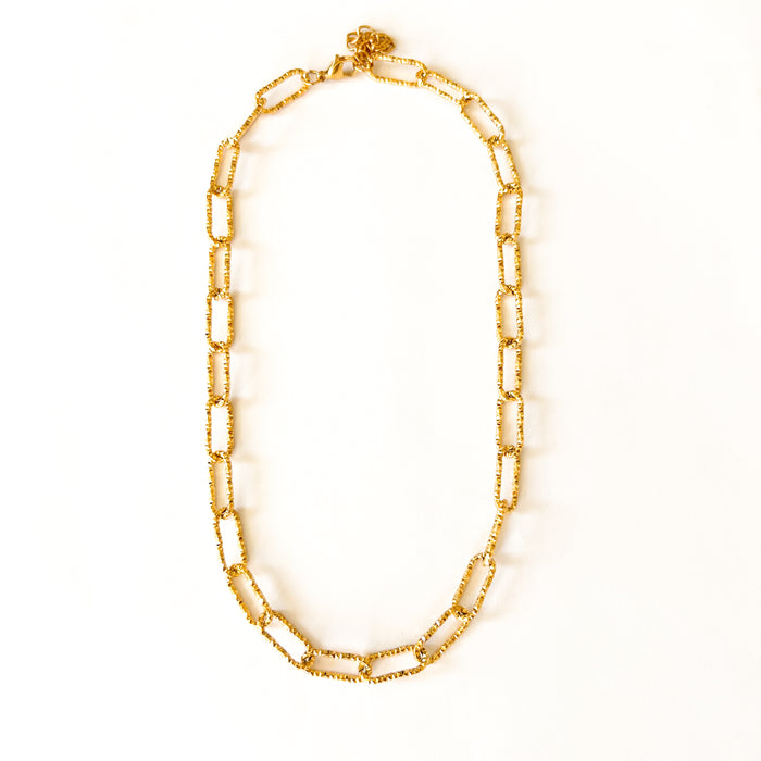 Fabiola chain necklace by Ellie Vail. Textured gold paper clip chain. 15" length with 2" extender. Sweat, water and tarnish resistant. Made of marine grade stainless steel with gold plating.