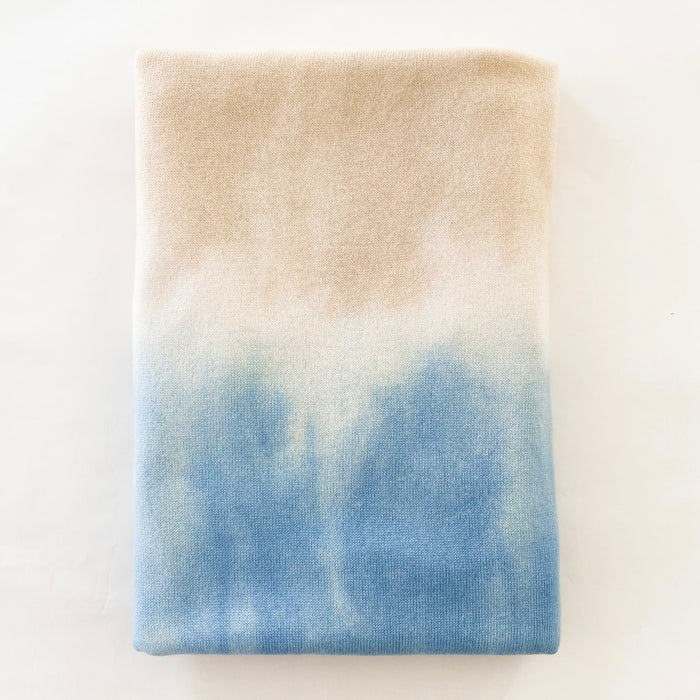 Surf + Sand dip dyed cashmere wrap. Hand dyed in a combination of surf blue, white and sand that looks like the tide. on 100% cashmere jersey. 32" x 90".