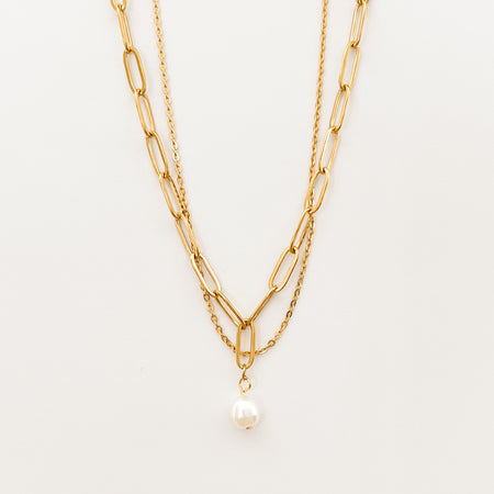 Renee double chain necklace by Ellie Vail. Delicate gold chain layered with a paperclip chain and pearl pendant. 13.5" length with 4" extender. Sweat, water and tarnish resistant. Made of marine grade stainless steel with gold plating and natural pearl.