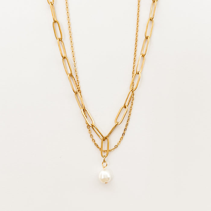 Renee double chain necklace by Ellie Vail. Delicate gold chain layered with a paperclip chain and pearl pendant. 13.5" length with 4" extender. Sweat, water and tarnish resistant. Made of marine grade stainless steel with gold plating and natural pearl.