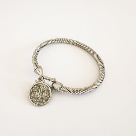 Silver Maya coin bracelet by Ellie Vail. Twisted metal rope bracelet with equestrian inspired spring hook clasp and coin pendant. Sweat, water and tarnish resistant. Made of hypoallergenic stainless steel with silver plating. Measures 8" circumference.