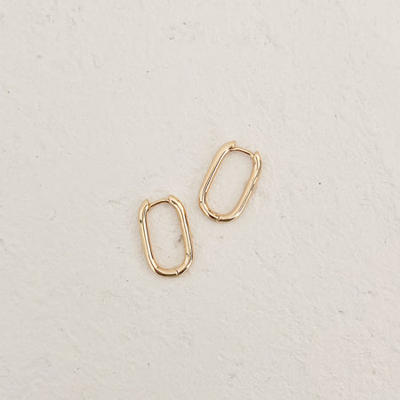 Gold vermeil oblong hoop earrings. Measures .75" length x .5" width. Wear alone or layer mini charms for individual style.