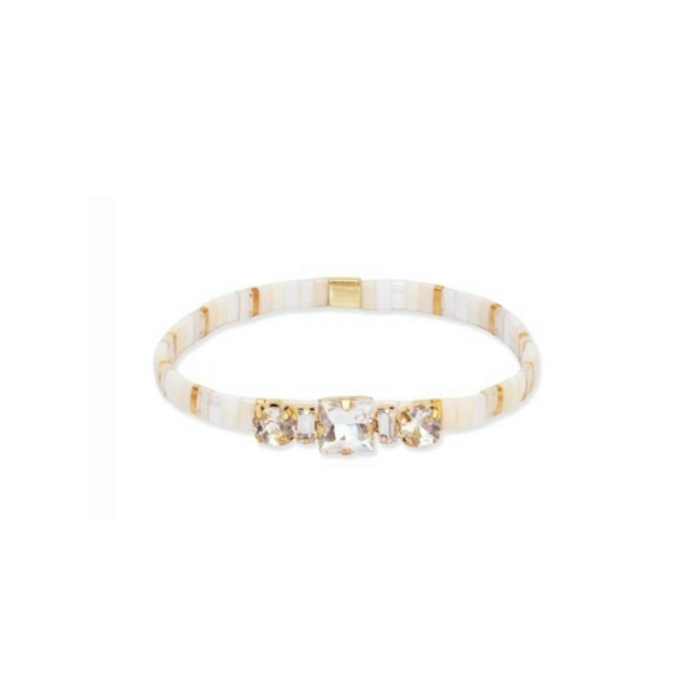 Bejeweled Tila bracelet in "shell". Made of glass tiles in a mix of white, soft neutrals and gold. Embellished with three clear crystal cut CZ stones. Stretch bracelet, fits close to the wrist.