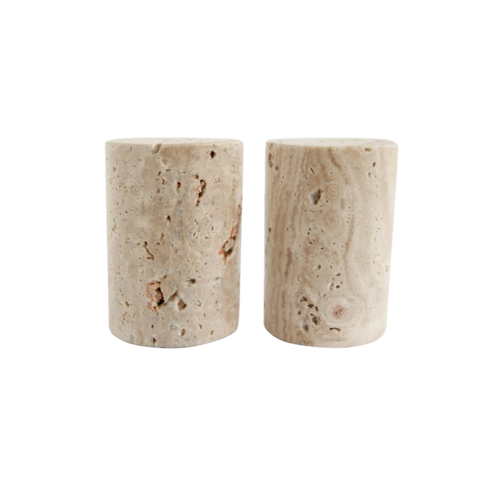 Set of two salt and pepper shakers crafted from natural Travertine in a sand color. Column shape measures 2" diameter x 3" high. Hand wash only.