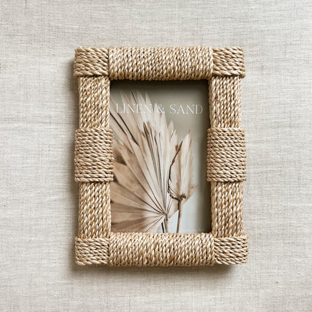 Abaca rope frame, holds a 4" x 6" picture. Rectangular frame covered in natural woven Abaca rope. Back stand allows for photo to be displayed horizontally or vertically.