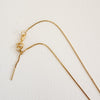 Delicate gold filled diamond cut box chain with ring clasp and pull adjuster. Necklace adjusts up to 18 inch length.