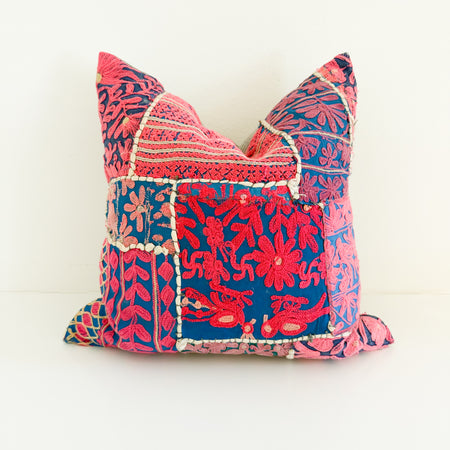 One of a kind decorative pillow made from a vintage Indian textile with vibrant pink embroidery on an indigo ground. Down insert included. 18 inch square. 