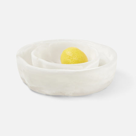 Stack of the medium and large Amalfi serving bowls. Each sold separately. Organic shaped bowls made in swirls of luxe white resin. Suitable for indoor and outdoor serving. Medium 7 x 2.5 inches. Large 10 x 3 inches.