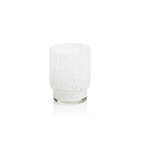 Amalfi Tumbler beautifully crafted in clear and white glass blown glass in a tortoise-like pattern. Modern and sculpted silhouette feels good in the hand and stacks for a neatly organized bar shelf. 4" tall x 3" diameter.