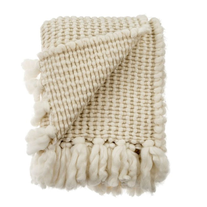 Aspen Throw. Luxury throw woven in chunky, soft winter white wool yarns. Ends are finished with loft fringe. Measures 52" x68". Wool/Acrylic blend. Dry clean only.