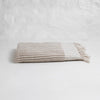 Taupe and ivory stripe bath towel with hand knotted fringe edges. 100% Turkish cotton.