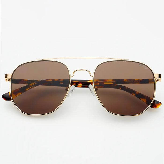 Aviator style sunglasses with gold frame and tortoiseshell arms on a white background.