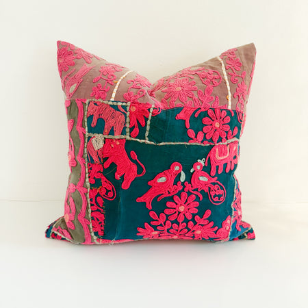 18 inch square vintage Indian pillow featuring bright fuchsia embroidery of birds and flowers on a teal base. 