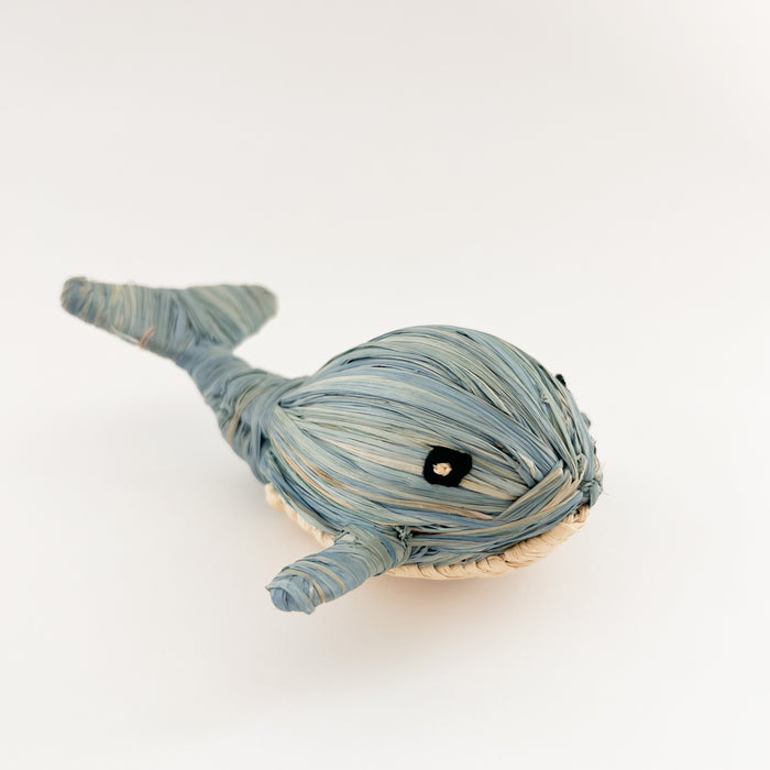 Whale ornament handwoven in soft blue and natural raffia. Each piece sold separately. Hand crafted by skilled artisans in Uganda.
