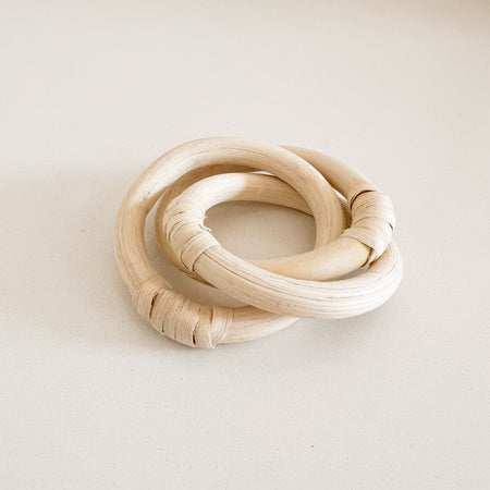 Rattan link napkin rings. Three interlocking rings made of natural rattan create interest at the table. Each ring has a 2.5" diameter.