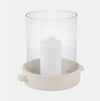 Clear glass hurricane candle holder with beige ceramic base. 10 inch high x 10 diameter.