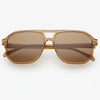 Aviator style sunglasses  with a translucent brown acetate frame on a white background.