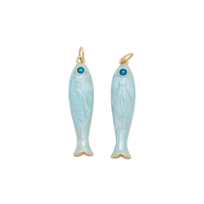 Two fish shaped charms in pale blue enamel with a blue CZ stone eye and gold accents. Each sold individually. 18K gold filled over brass.