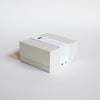 White box with paper band containing Erode's Sculpted Cold Press Soap. 
