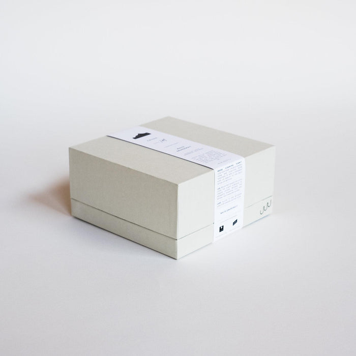 White box with paper band containing Erode's Sculpted Cold Press Soap. 