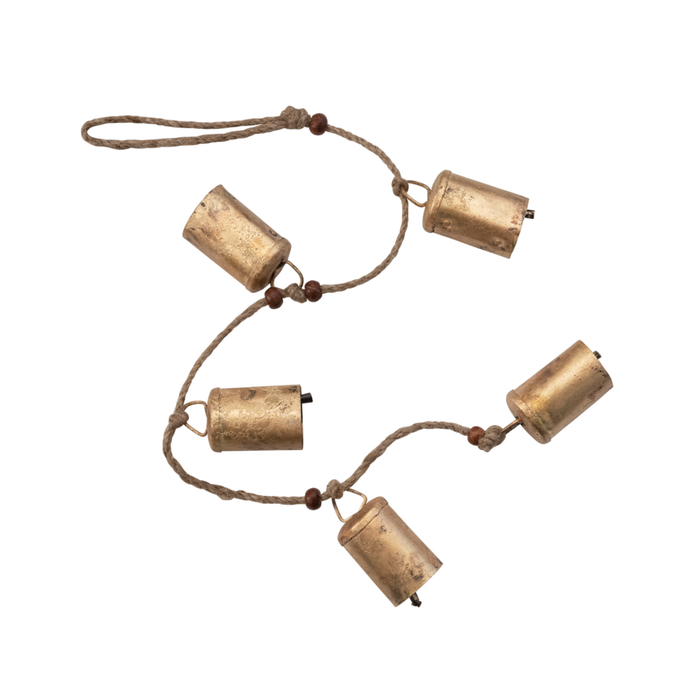 Decorative brass bells strung on a natural jute rope with wood beads. 28" length strand of iron bells with a antique brass finish with raw wood chime. Each bell measures 2" height 