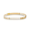 White, beige and gold stretch bracelet made with flat, square "Tila" beads. One size fits most.