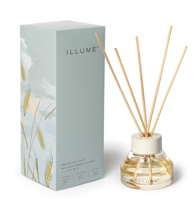Illume Fresh Sea Salt Diffuser. Diffuser oil with reeds in a clear glass re-fillable bottle. Sea foam blue box packaging measures 3.5"x 3.5" x 9". 3 fluid oz of frgrance oil with the scent of salty sea spray and sweet jasmine.