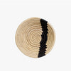 Mala basket bowl. Small natural sweetgrass and raffia basket shaped into a small bowl with a black stripe. 6" diameter 1.5" height. Made by skilled craftswomen in Uganda.