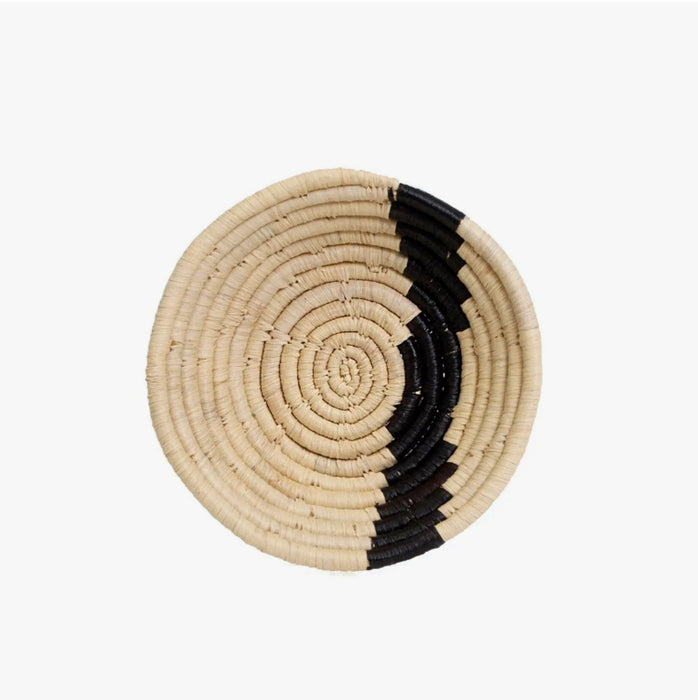 Mala basket bowl. Small natural sweetgrass and raffia basket shaped into a small bowl with a black stripe. 6" diameter 1.5" height. Made by skilled craftswomen in Uganda.