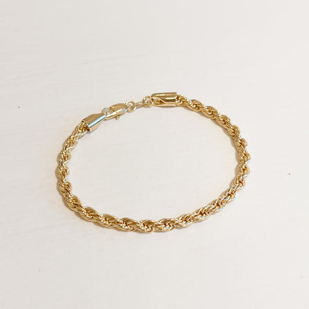 Cleo gold rope bracelet. Twisted 18K gold filled chain with a lobster claw clasp. Measures 7".