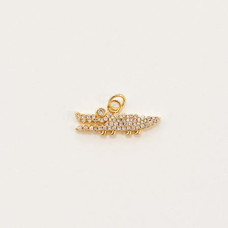 Sparkle gator charm. 14k gold filled charm with clear CZ pave' crystals inset. Designed to mix and layer on our charm builder necklaces, sold separately. Measures 7/8" length 3/8" height.