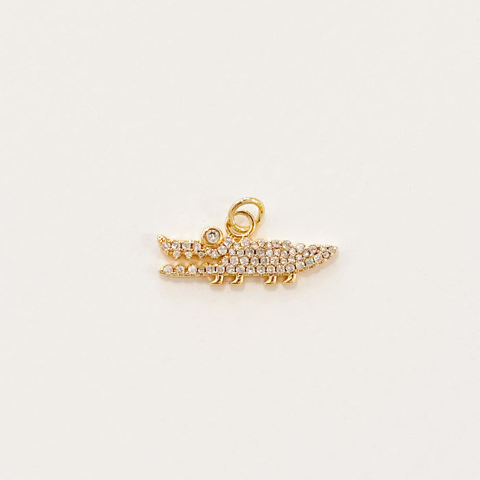 Sparkle gator charm. 14k gold filled charm with clear CZ pave' crystals inset. Designed to mix and layer on our charm builder necklaces, sold separately. Measures 7/8" length 3/8" height.