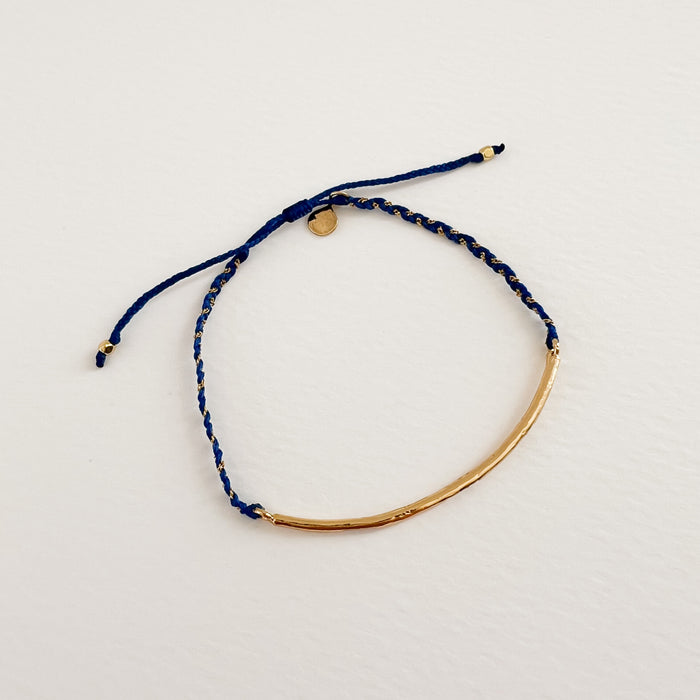 Blue and gold braided Boho bracelet featuring a slim gold filled bar with tiny CZ crystals embedded in it. Adjustable, one size fits most. Hand crafted by TAI Jewelry.