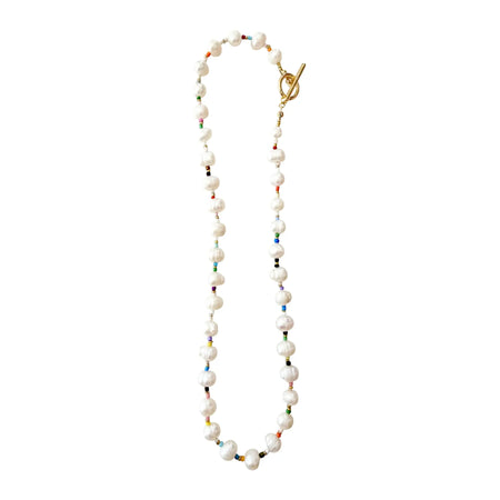 White pearl necklace with multi color seed beads and a gold toggle clasp. Measures 18 inch length.