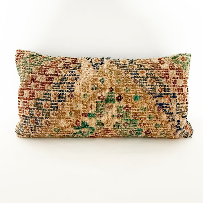 12 x 24 inch lumbar pillow made from a vintage Turkish textile. Geometric pattern woven in sun-faded shades of sage, emerald, blue, lavendar, tan and sepia. Wear of the weave reflects the natural vintage aspect of the textile. Solid blue back with zip closure.